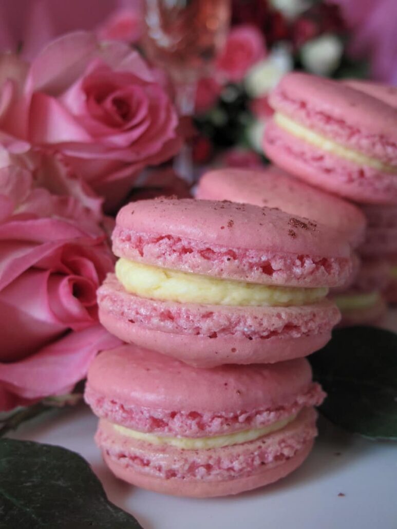 pastel pink rose macarons - sandwiched cookies surrounded by roses